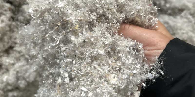 Hand holding super cell recycled product